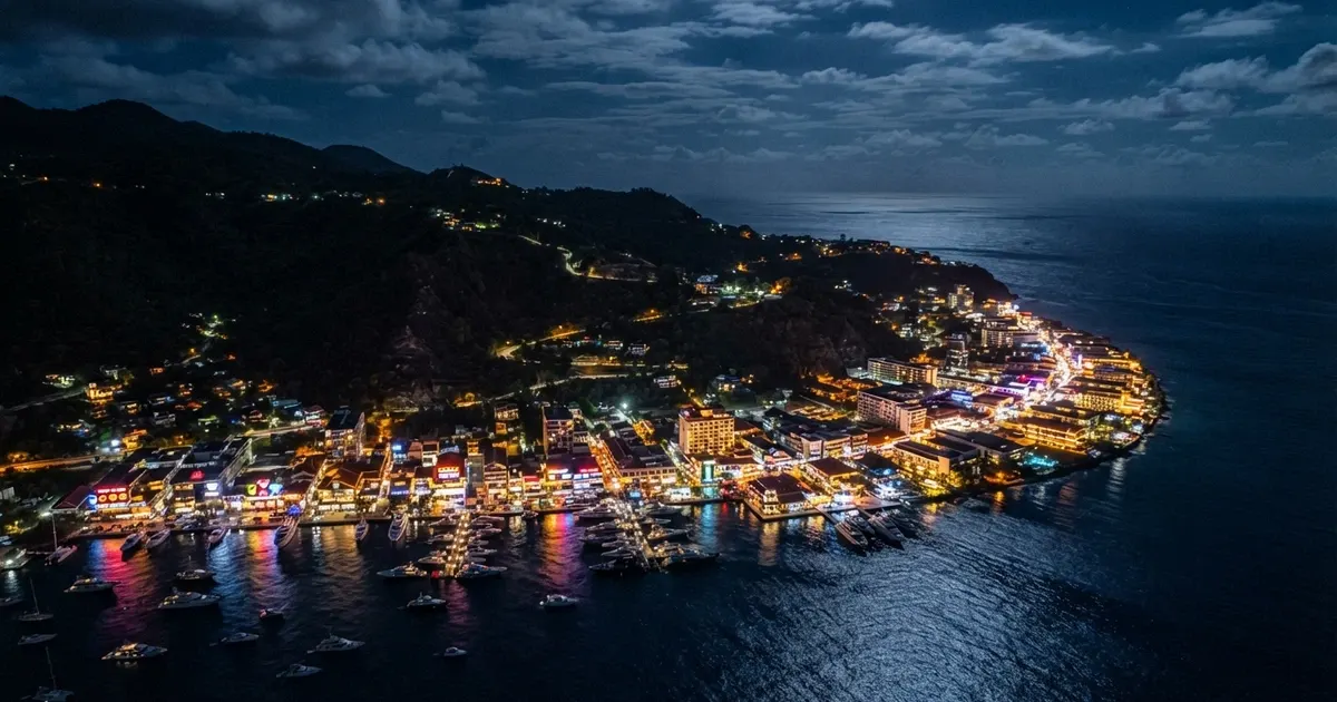 Carte de l'île d'Anjouan avec le logo de l'Anjouan Gaming Authority et une icône de casino en ligne, sur fond bleu nuit